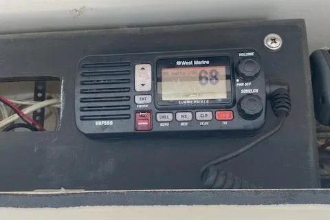 Slide: The Image of VHF radio on 2001 Regulator 26 Forward Seating boat dashboard. - 13