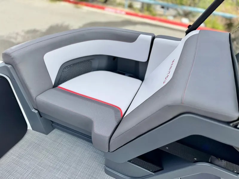 Slide: The Image of 2025 Manitou Cruise 20 Bench Twin Tube, featuring sleek gray and white seating design. - 10