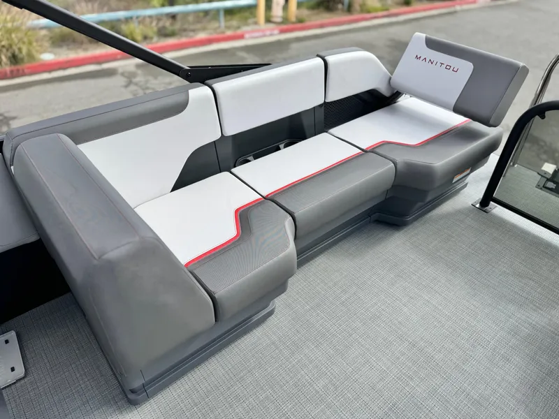 Slide: The Image of 2025 Manitou Cruise 20 Bench Twin Tube with modern gray and white seating design. - 14