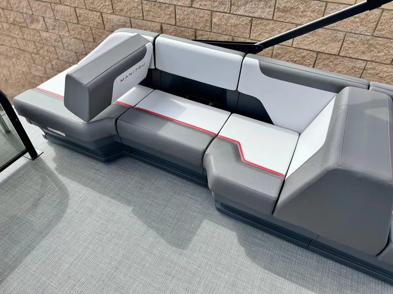Slide: The Image of 2025 Manitou Cruise 20 Bench Twin Tube with sleek gray and white seating. - 17