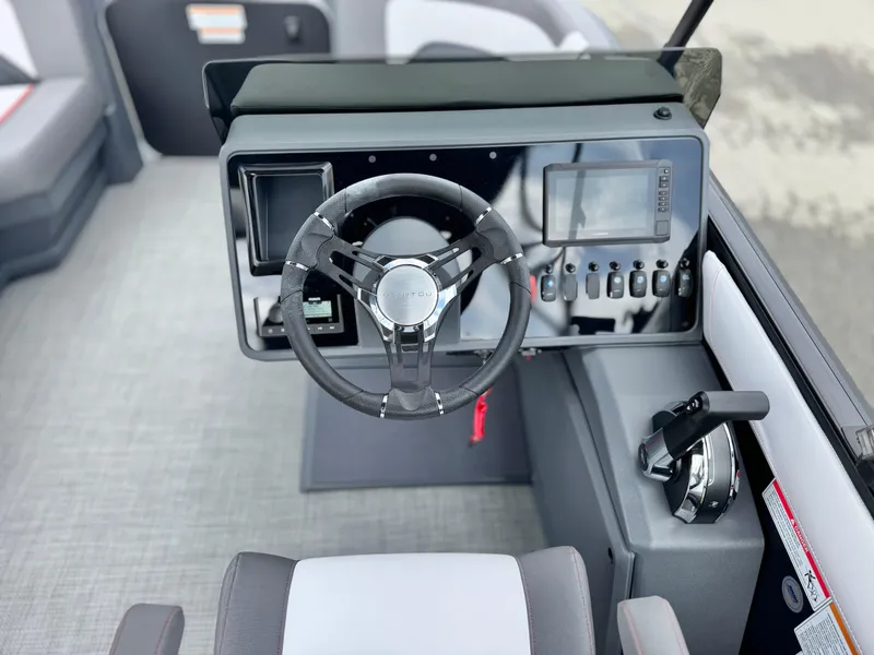 Slide: The Image of Steering console of 2025 Manitou Cruise 20 Bench Twin Tube boat. - 21