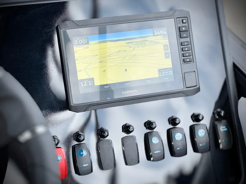 Slide: The Image of Garmin navigation system on 2025 Manitou Cruise 20 Bench Twin Tube dashboard. - 24