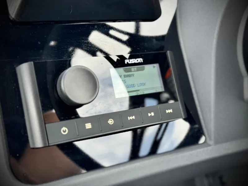 Slide: The Image of Fusion audio system on 2025 Manitou Cruise 20 Bench Twin Tube boat dashboard. - 25
