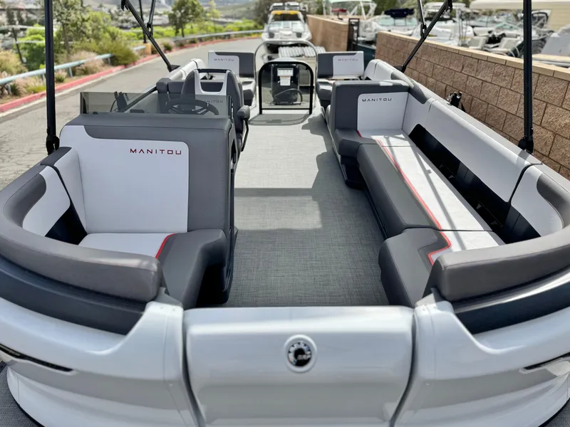 Slide: The Image of 2025 Manitou Cruise 20 Bench Twin Tube pontoon boat with spacious seating and modern design. - 8