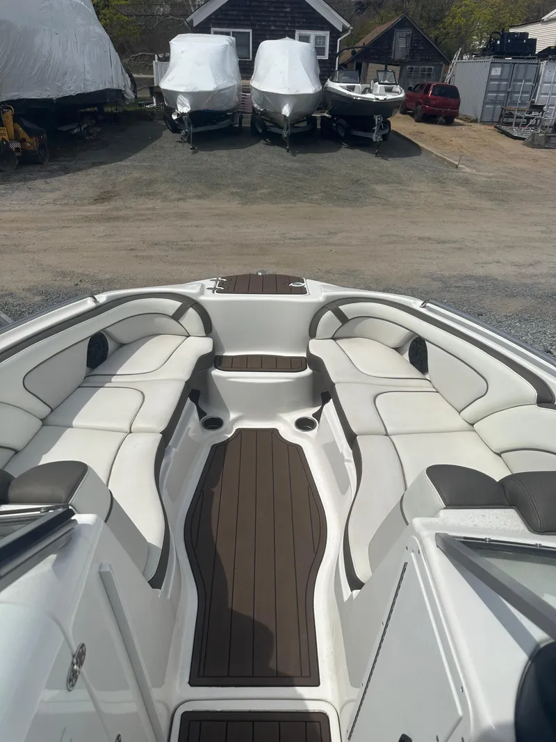 Slide: The Image of 2013 Yamaha Boats 242 Limited S interior with spacious seating and elegant design. - 14