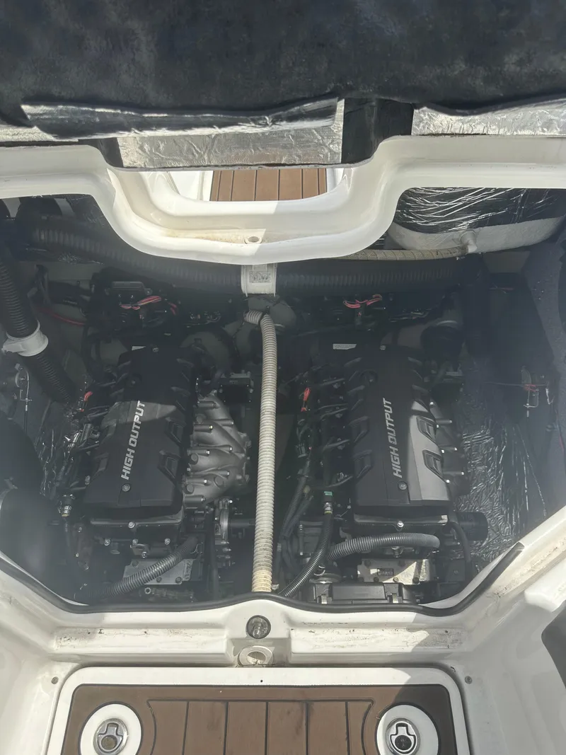 Slide: The Image of Engine compartment of a 2013 Yamaha Boats 242 Limited S, showcasing dual engines. - 18