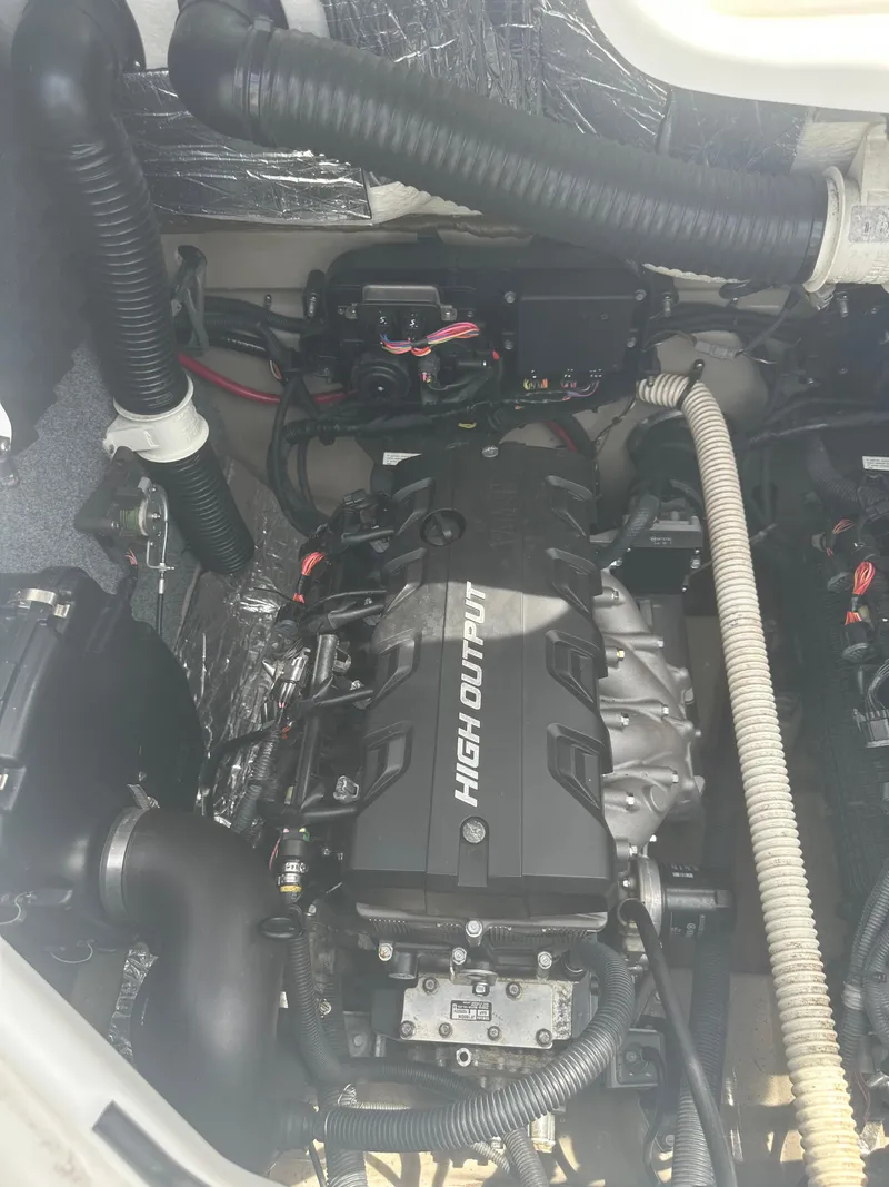 Slide: The Image of 2013 Yamaha Boats 242 Limited S engine compartment, showcasing high output engine components. - 20
