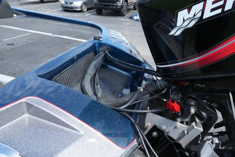 Slide: The Image of 2005 Ranger Z20 boat with Mercury engine in parking lot. - 12