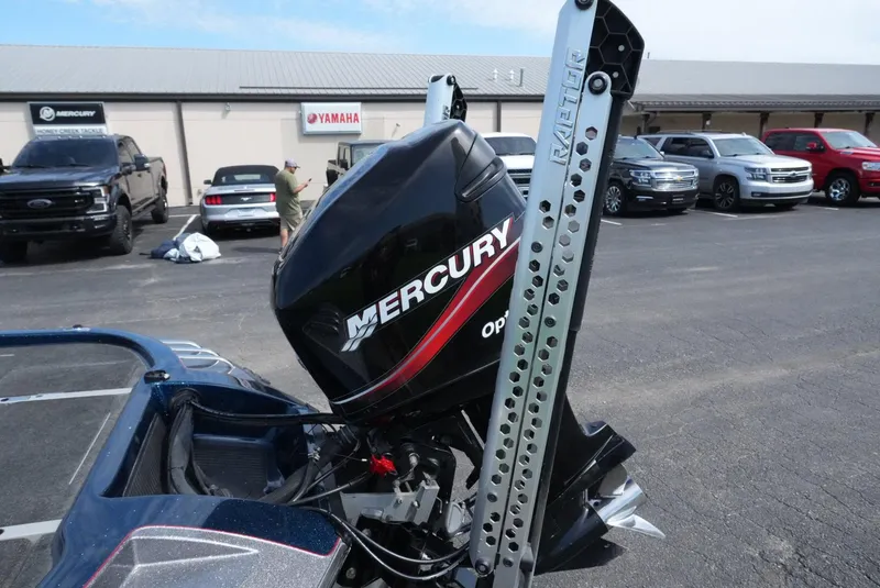 Slide: The Image of 2005 Ranger Z20 boat with Mercury outboard motor in parking lot. - 13