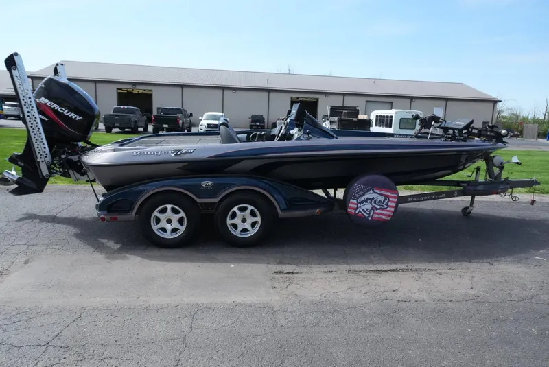 Slide: The Image of 2005 Ranger Z20 boat with Mercury engine on trailer, parked outdoors. - 5