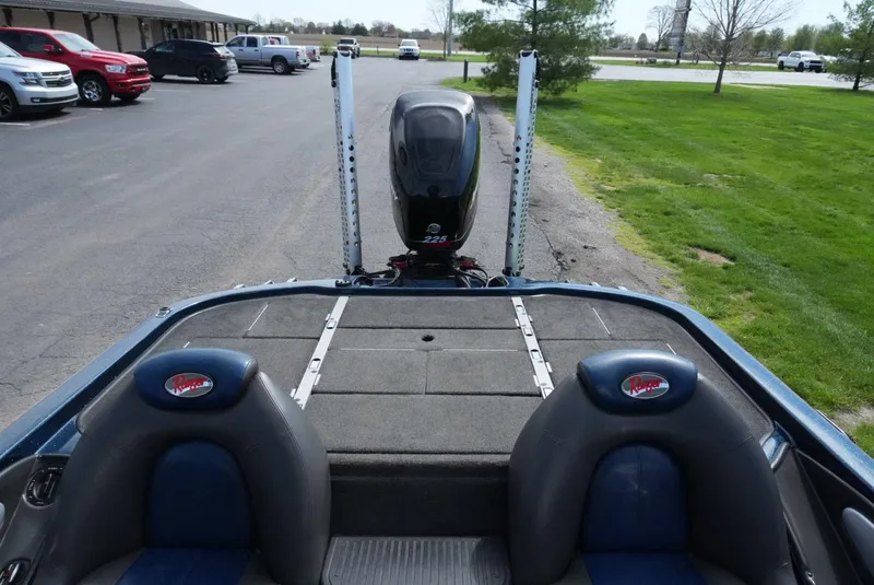 Slide: The Image of 2005 Ranger Z20 boat with dual seats and motor, parked on a paved area. - 8