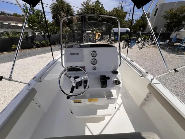 Slide: The Image of 2025 Key West 189 FS boat interior with steering wheel and control panel. - 12
