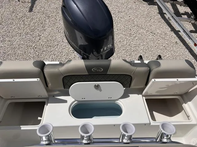 Slide: The Image of 2025 Key West 189 FS boat interior with motor and storage compartments. - 16