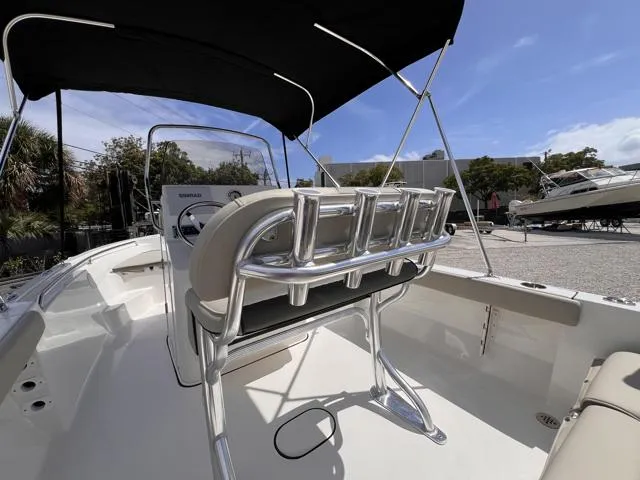 Slide: The Image of 2025 Key West 189 FS boat interior with seating and steering console under a canopy. - 17