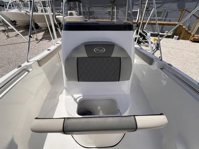 Slide: The Image of 2025 Key West 189 FS boat interior with cushioned seating and console. - 21