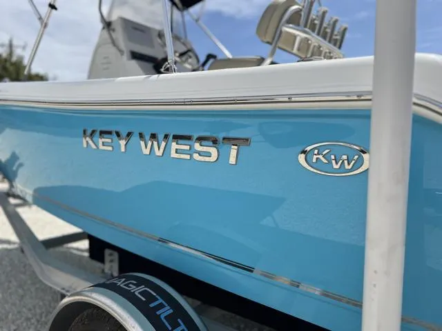 Slide: The Image of 2025 Key West 189 FS boat, blue exterior, close-up view, on trailer. - 28