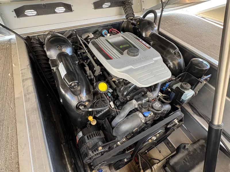 Slide: The Image of Engine compartment of a 2013 Bennington 2575 RCW IO boat, showcasing detailed components. - 14