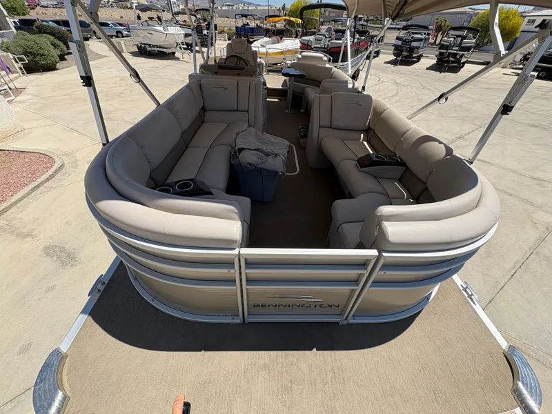 Slide: The Image of 2013 Bennington 2575 RCW IO pontoon boat with spacious seating and modern design. - 4