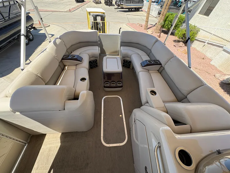Slide: The Image of 2013 Bennington 2575 RCW IO pontoon boat with spacious seating and cup holders. - 5