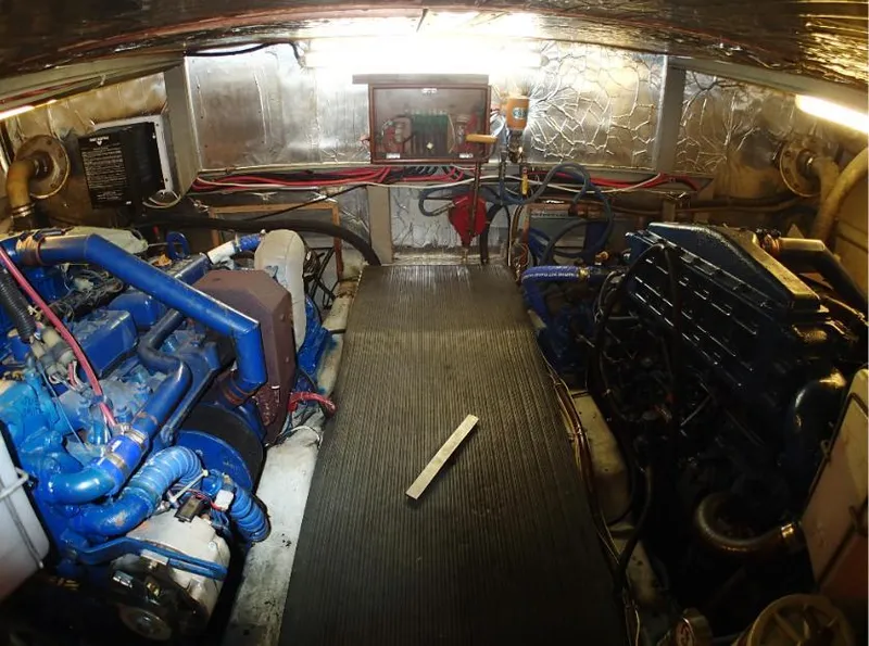 Slide: The Image of Engine room of 1987 Tayana 45 Expedition Trawler with visible machinery and equipment. - 24