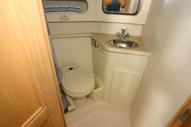 Slide: The Image of Bathroom interior of a 1997 Carver 405 yacht with sink and toilet. - 6