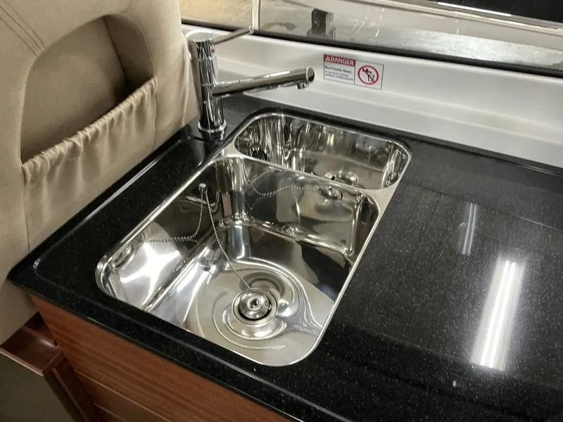 Slide: The Image of Stainless steel sink in 2025 Nimbus 365 Coupe boat kitchen. - 15
