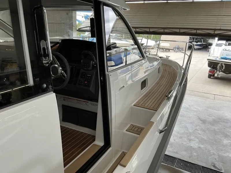 Slide: The Image of 2025 Nimbus 365 Coupe yacht with sleek design and modern interior. - 18