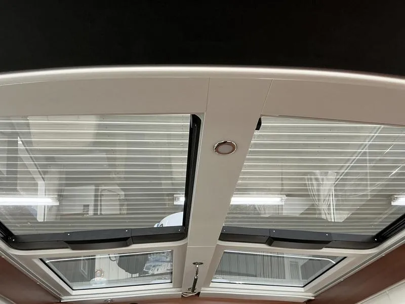 Slide: The Image of Skylight view inside 2025 Nimbus 365 Coupe, showcasing modern design and natural lighting. - 25