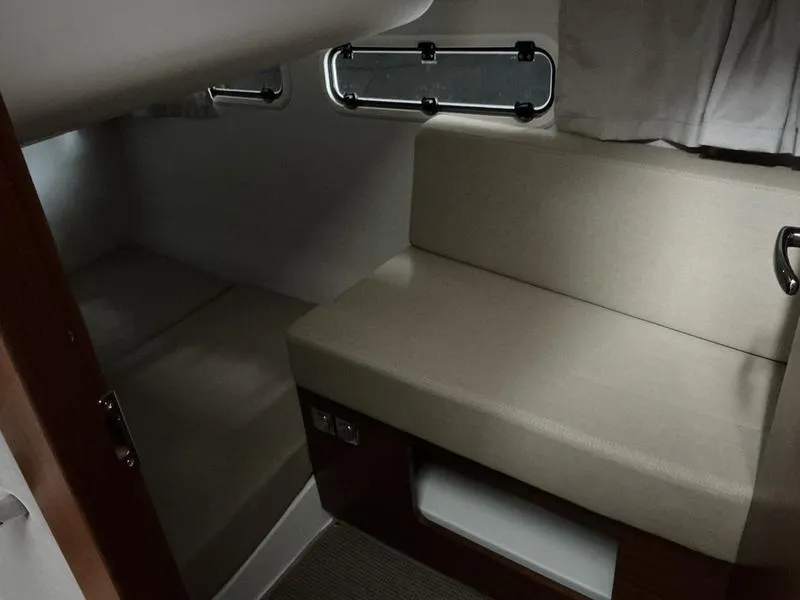 Slide: The Image of Interior cabin of 2025 Nimbus 365 Coupe, featuring beige seating and modern design. - 39