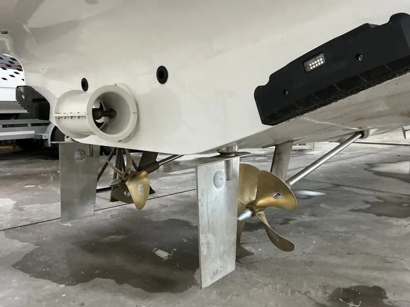 Slide: The Image of Underwater view of 2025 Nimbus 365 Coupe boat propellers and hull in a dry dock. - 4