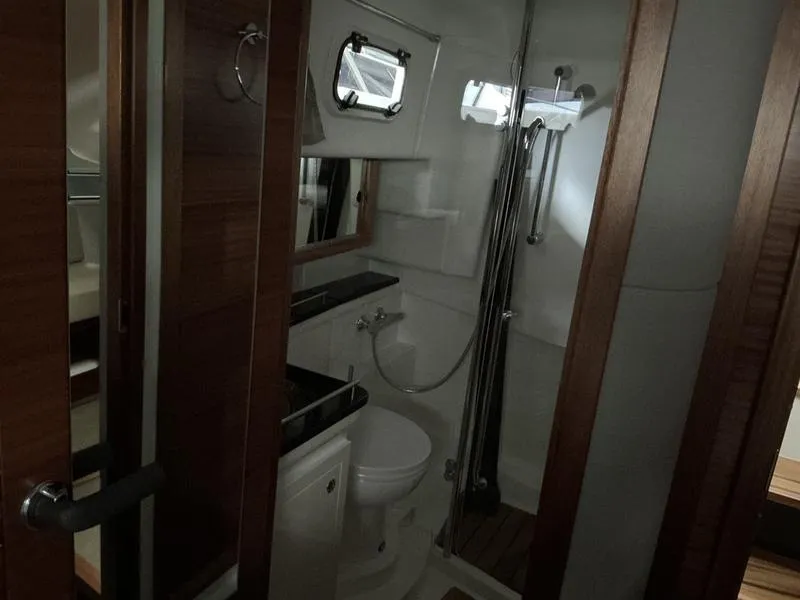 Slide: The Image of 2025 Nimbus 365 Coupe bathroom with modern fixtures and wooden accents. - 40