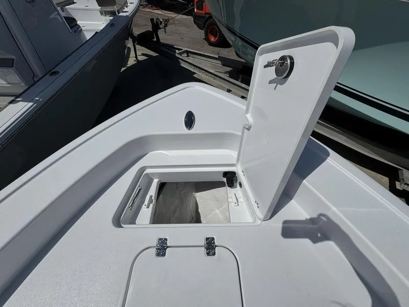 Slide: The Image of 2025 Sportsman Masters 267 boat with open storage compartment on deck. - 11
