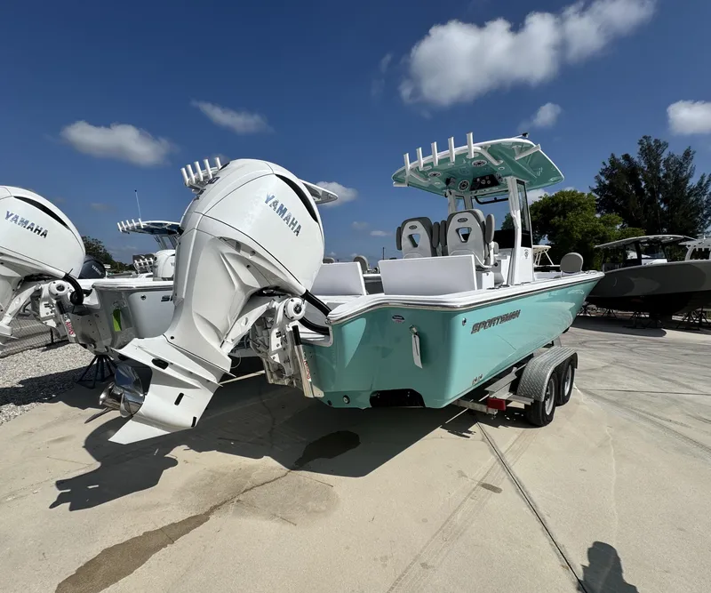 Slide: The Image of 2025 Sportsman Masters 267 boat with Yamaha engines on a trailer, under a clear blue sky. - 2