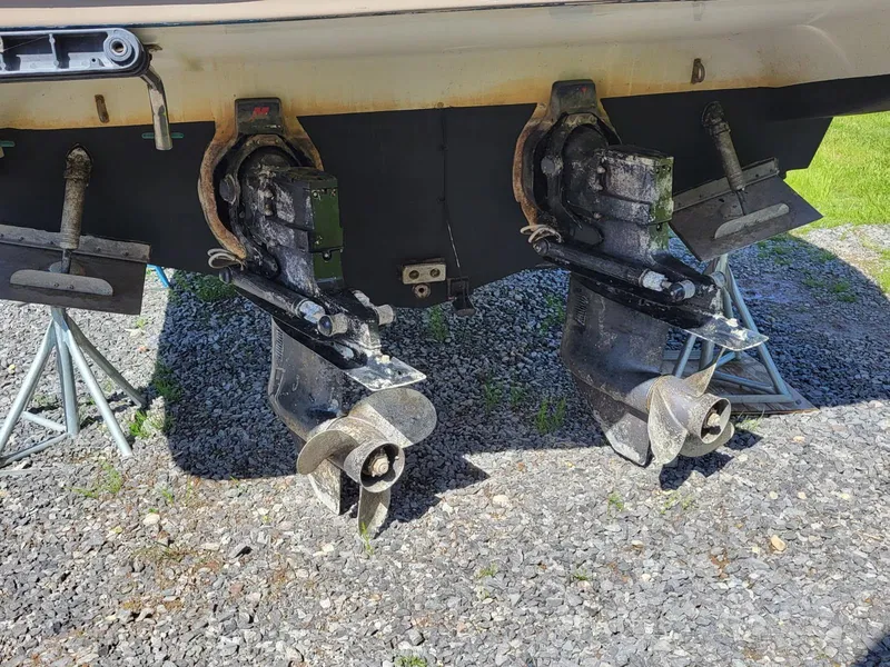 Slide: The Image of Twin propellers of a 2000 Maxim Yachts 3300SCR on a gravel surface. - 2