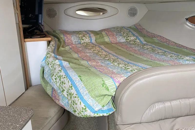 Slide: The Image of Cozy cabin interior of 2000 Maxim Yachts 3300SCR with colorful quilted bedding. - 20