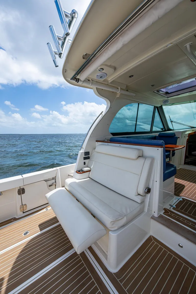 Slide: The Image of 2021 Hinckley Sport Boat 40 X, featuring luxurious seating and ocean view. - 10