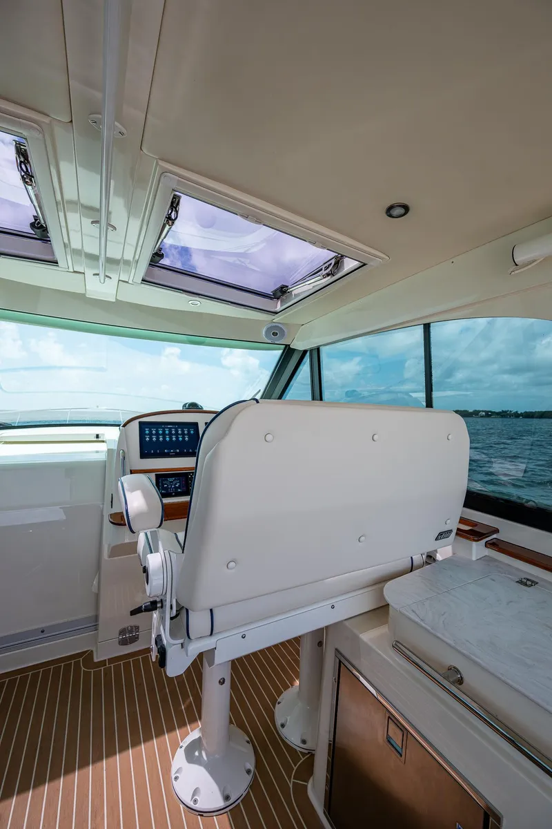 Slide: The Image of Interior of 2021 Hinckley Sport Boat 40 X with helm and panoramic windows. - 15