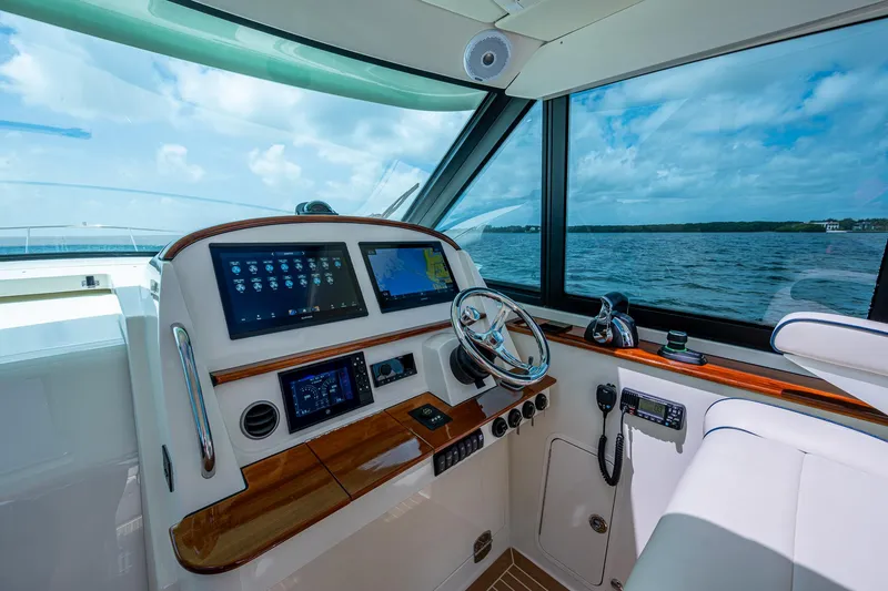 Slide: The Image of Helm of 2021 Hinckley Sport Boat 40 X with modern controls and ocean view. - 16