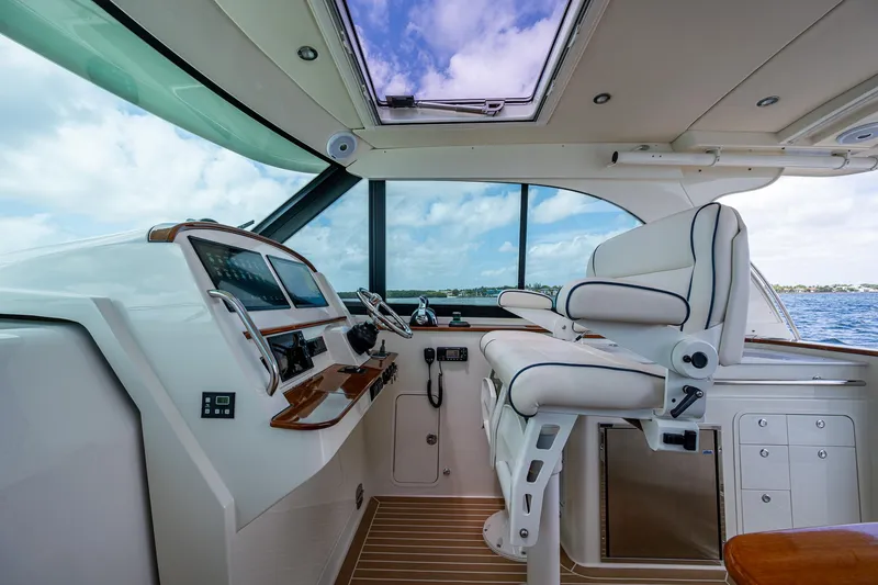 Slide: The Image of Interior of 2021 Hinckley Sport Boat 40 X, featuring modern helm and seating. - 17