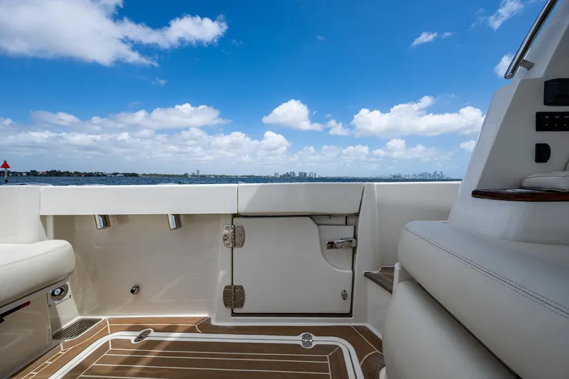 Slide: The Image of 2021 Hinckley Sport Boat 40 X deck with ocean view and blue sky. - 8