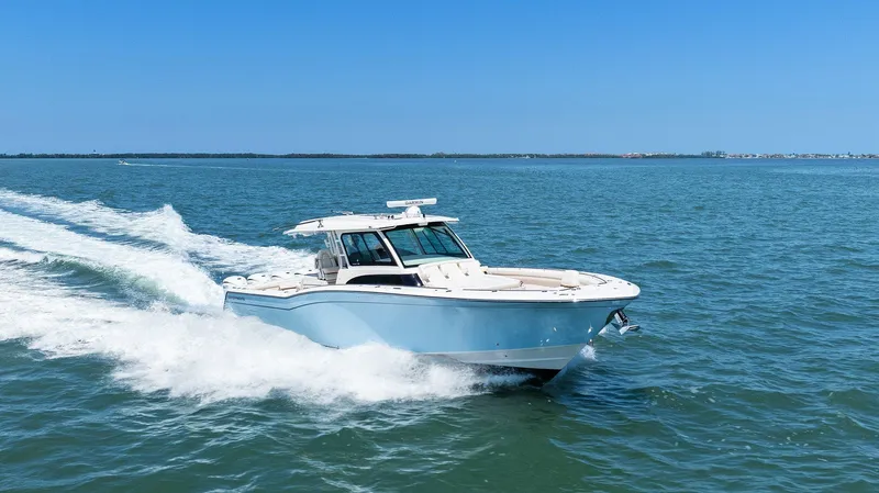 The Image of 2023 Grady-White Canyon 456 boat cruising on open water. - 0