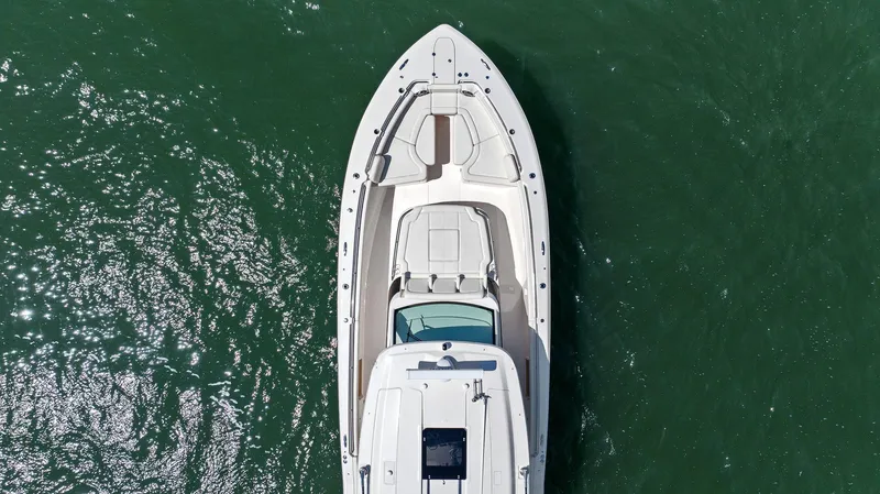 Slide: The Image of 2023 Grady-White Canyon 456 boat, aerial view on green water. - 16