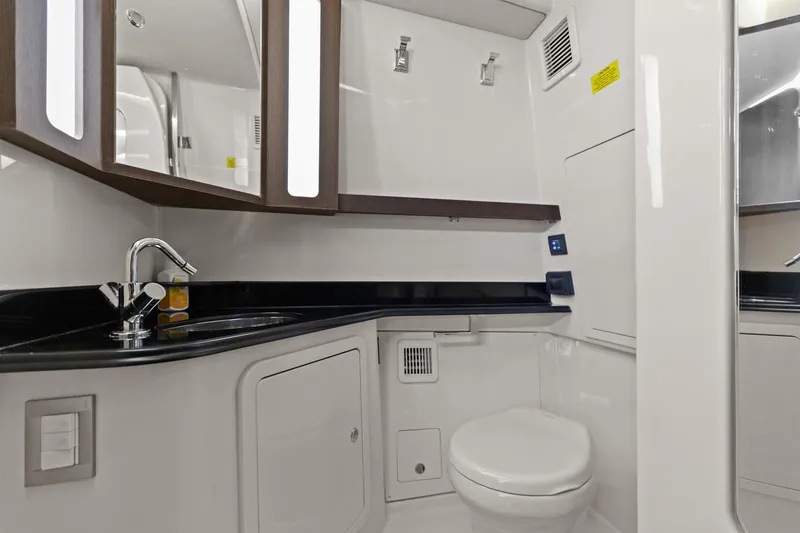 Slide: The Image of 2023 Grady-White Canyon 456 boat bathroom with modern fixtures and sleek design. - 26