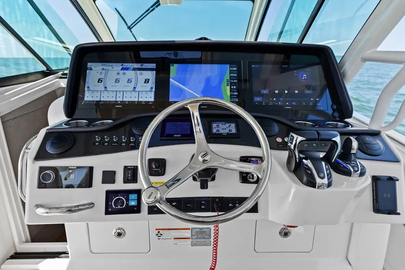 Slide: The Image of 2023 Grady-White Canyon 456 helm with advanced navigation and control systems. - 31