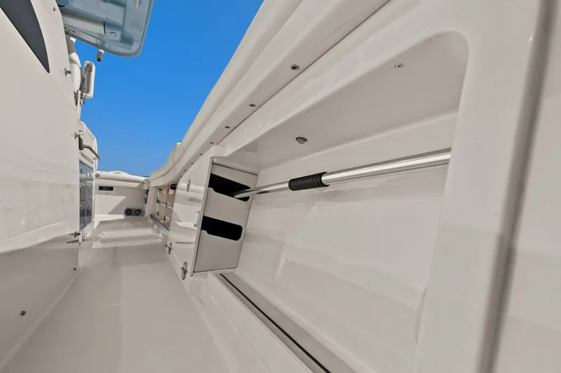 Slide: The Image of 2023 Grady-White Canyon 456 boat interior with storage compartments and sleek design. - 36