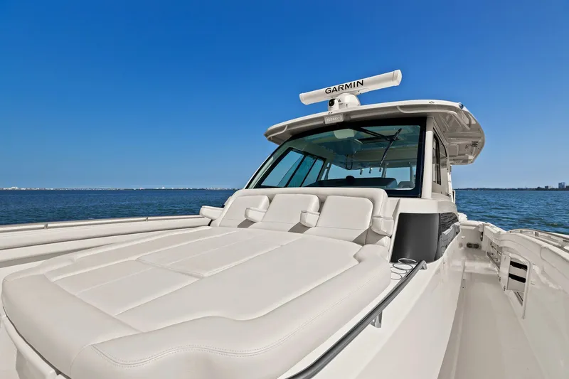 Slide: The Image of 2023 Grady-White Canyon 456 boat on open water, featuring sleek design and advanced navigation. - 37