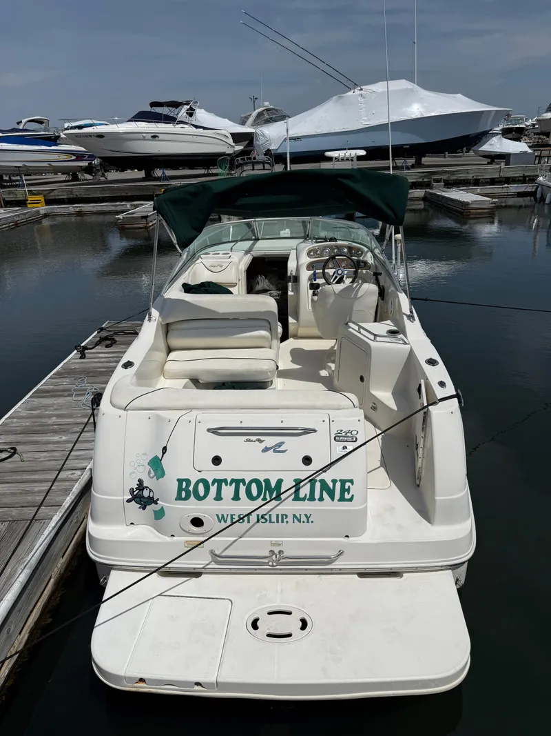 Slide: The Image of 2000 Sea Ray 240 Sundancer boat docked, named "Bottom Line," West Islip, NY. - 11