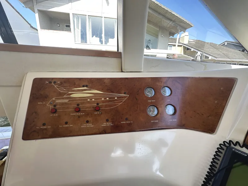 Slide: The Image of Control panel of a 1996 Azimut 54 yacht with gauges and switches. - 17
