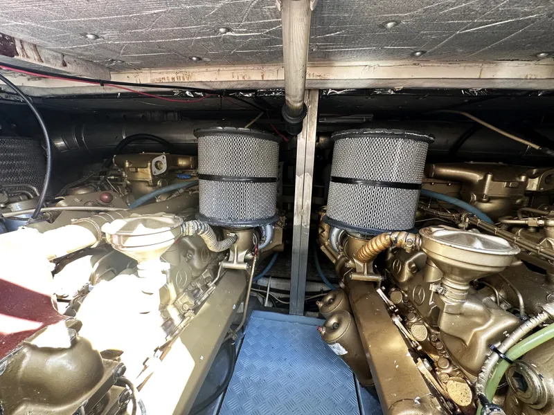 Slide: The Image of Engine room of a 1996 Azimut 54 yacht, showcasing dual engines and air filters. - 41