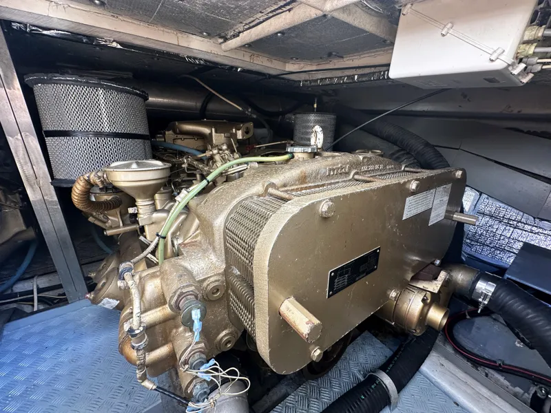 Slide: The Image of Engine room of a 1996 Azimut 54 yacht, showcasing detailed mechanical components. - 42